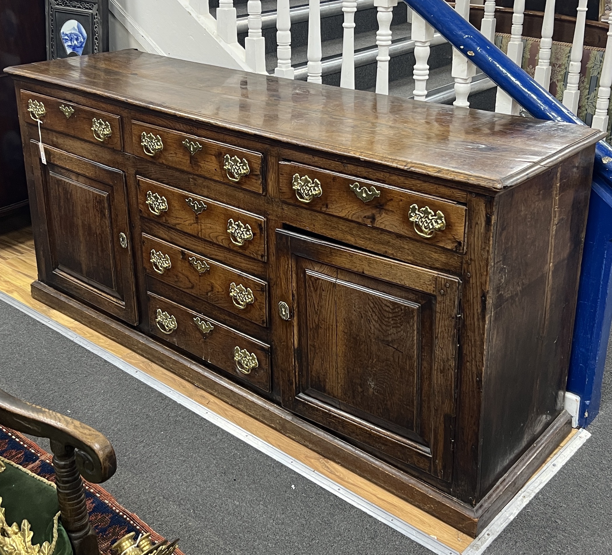 An 18th century oak low dresser, width 192cm, depth 51cm, height 89cm